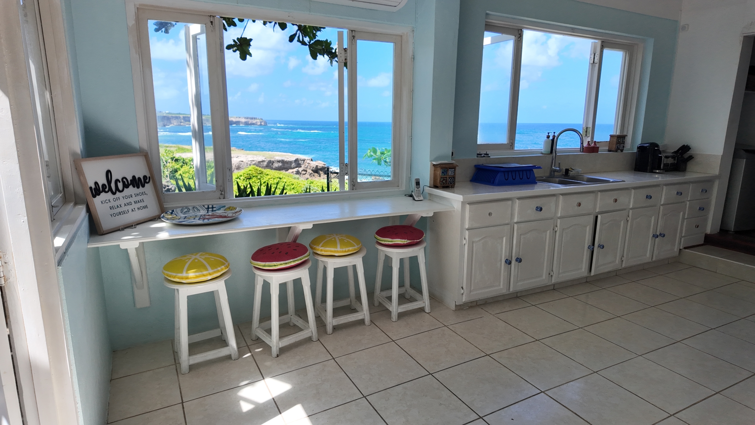 Lighthouse Landing view of ocean from two kitchen windows scaled