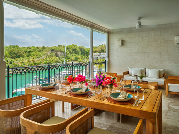 Pendry Residences Barbados patio dining table eith bougainvillea